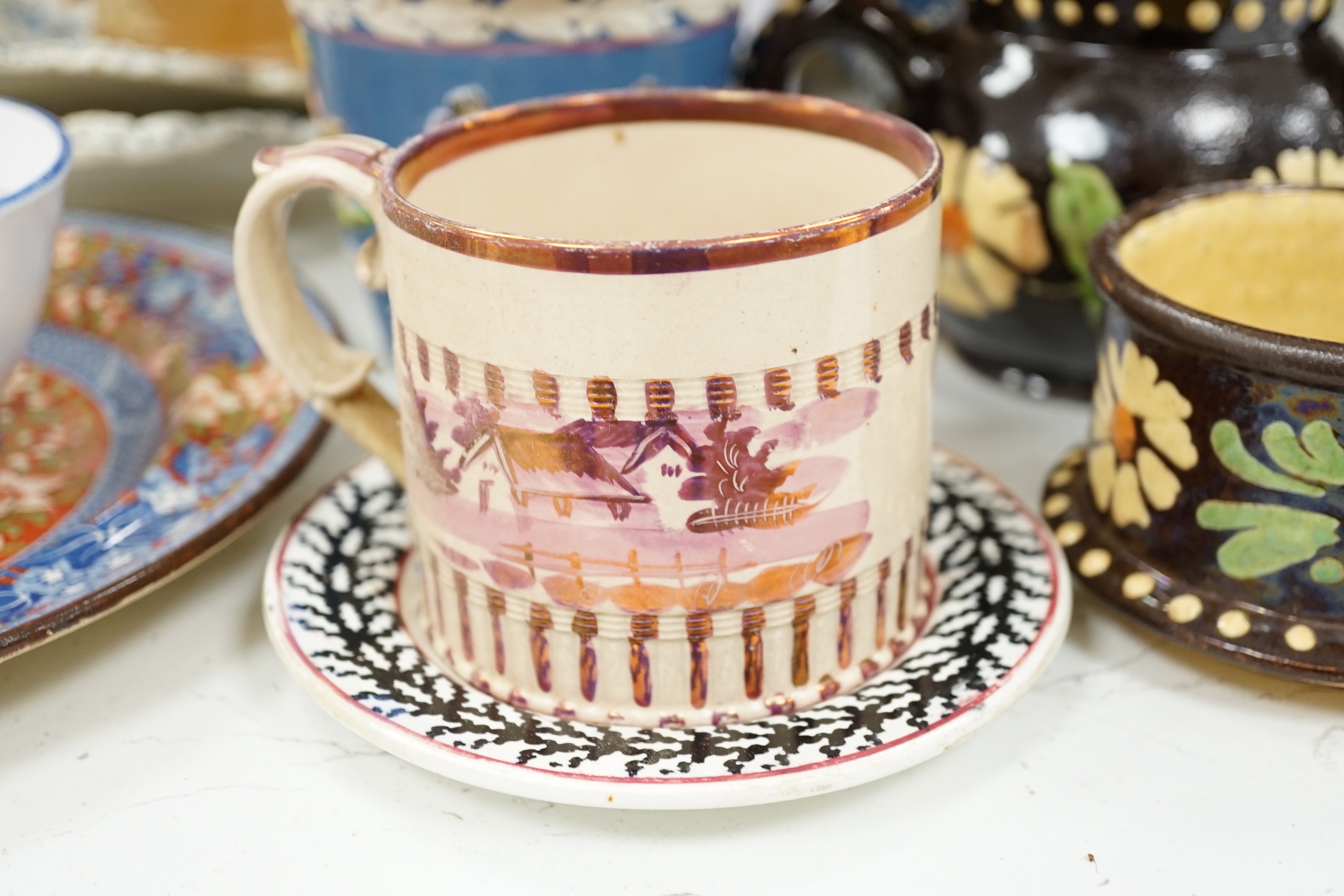 Two Pratt type jugs, an Enoch Wood flower pot, various 19th century pottery jugs, plates etc.